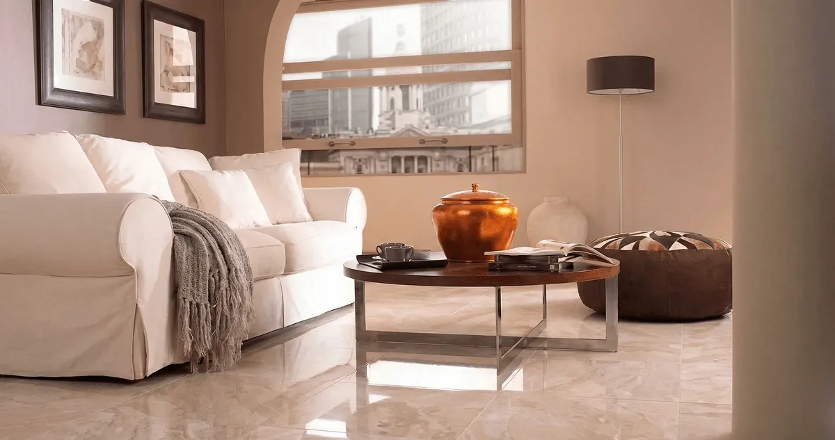 Modern living room with professionally installed marble flooring, a beige sofa, coffee table in South Bend, IN
